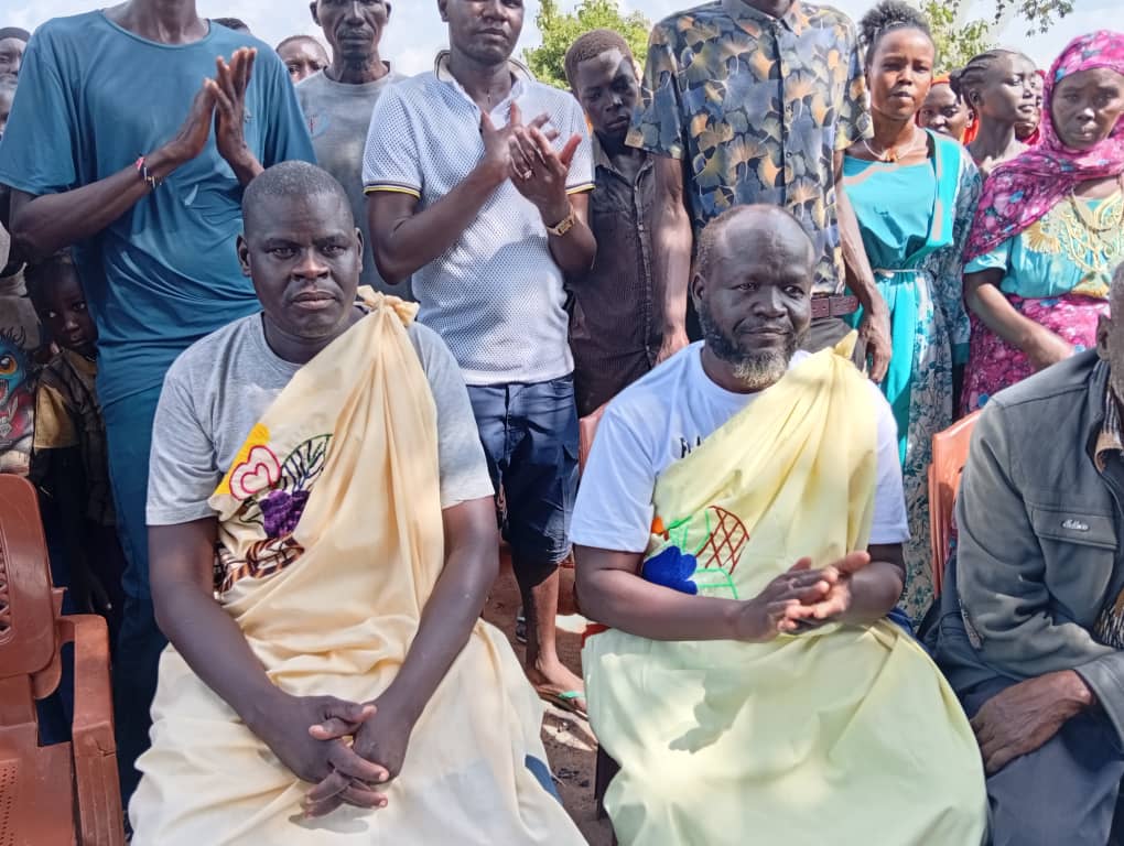 Members of the Thuri Community gathered together outdoors