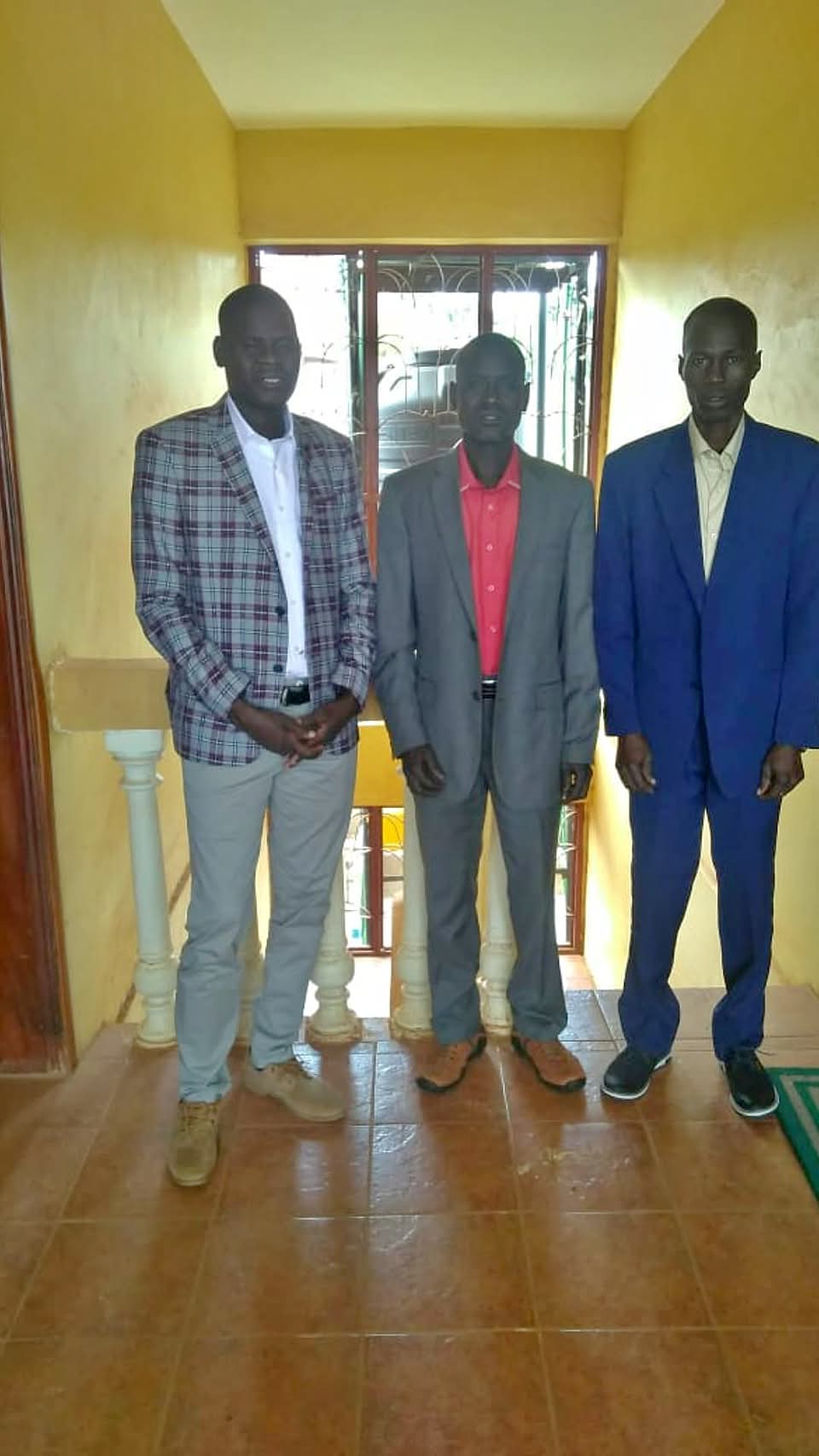 Three community members standing together