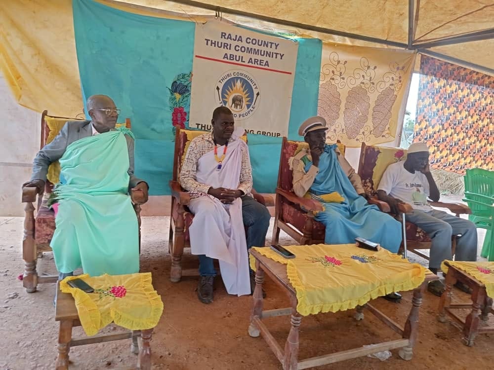 Thuri leaders seated at a community gathering in Abul